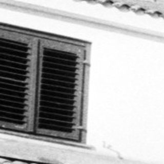 Mediterranean-style building with arched colonnade.