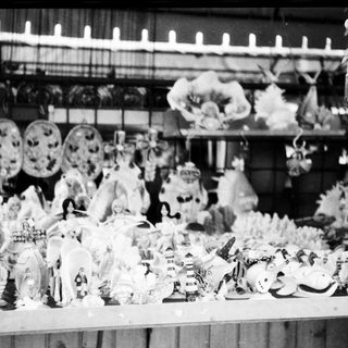 Vintage holiday display with ornate Christmas figurines and decorations.