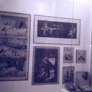 Vintage illustrated posters depicting historical or folkloric scenes.