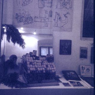 Traditional Czech Christmas pyramid display with nativity scene illustrations.