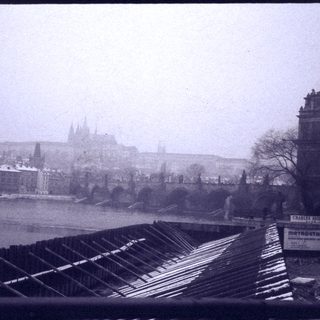 Historic cityscape with construction materials and metro sign.