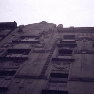 Art deco building facade with intricate sculptures.
