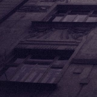 Art deco building facade with intricate sculptures.