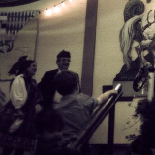 Live band performing in festive tent setting.