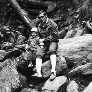 Two men fishing in a rocky stream.