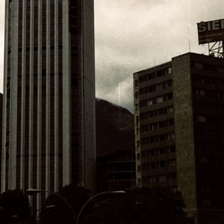 Tall modern skyscraper in urban setting.