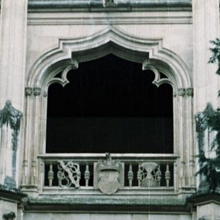 Gothic-style palace facade with intricate stone carvings.