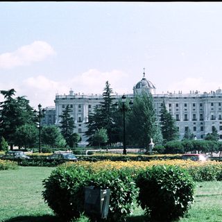 Grand historic building with landscaped gardens.