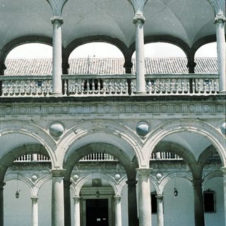 Elegant Renaissance-style cloister with arched colonnades.