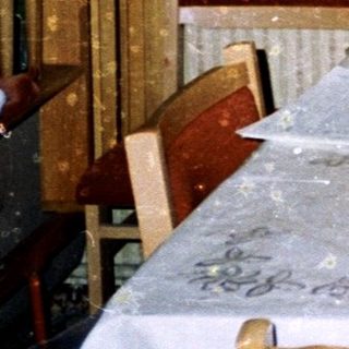 Man sitting at a table with papers.