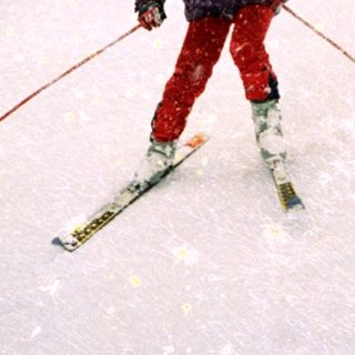 Person skiing in heavy snowfall on mountain trail.