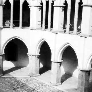 Gothic-style arched colonnade with stone arches.