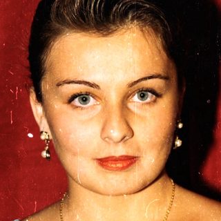 Wet woman in vintage bluesuit with star emblem.