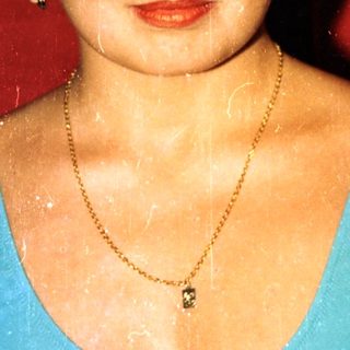 Wet woman in vintage bluesuit with star emblem.