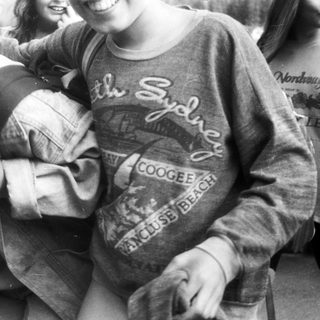 Group hug with Sydney-themed sweatshirts.