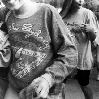 Group hug with Sydney-themed sweatshirts.