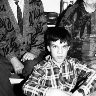 Family portrait with elderly couple and young boy.