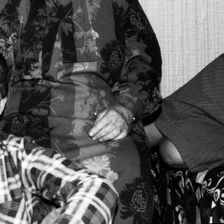 Family portrait with elderly couple and young boy.