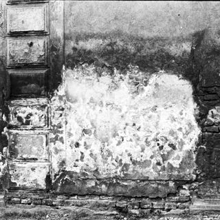 Destruction of building wall from bombing or shelling.