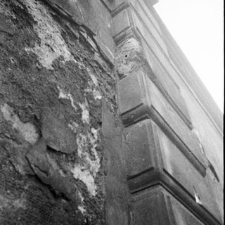 Damaged concrete and exposed rebar.