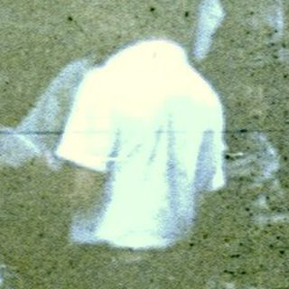 Blurry reflection of indoor seating area.