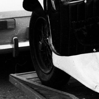 Vintage convertible car with open door.