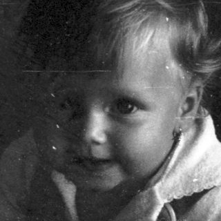 Young child playing with vinyl record.