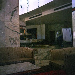 Marble interior with dim lighting, modern bathroom.