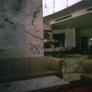 Marble interior with dim lighting, modern bathroom.