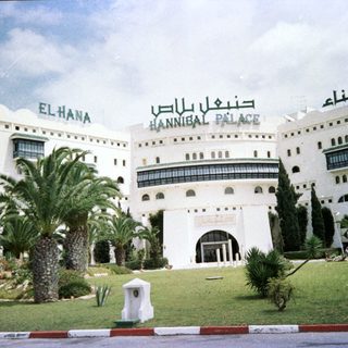 "Hannibal Palace hotel with Arabic signage."