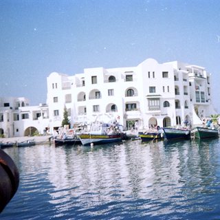 Waterfront buildings with docked boats.