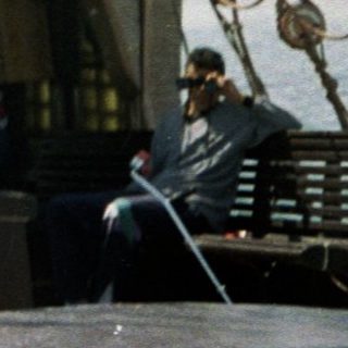 Traditional sailing ship with crew and passengers.