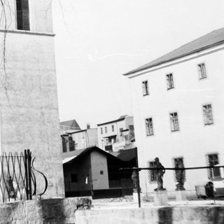Historic building with tall clock tower.