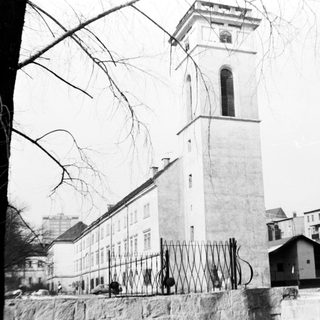Historic building with tall clock tower.