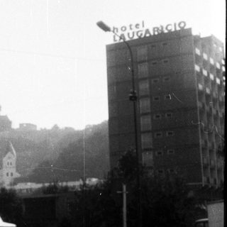 "Vintage city street with Hotel Dugaricio sign."