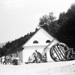 Historic water-powered mill with triangular building.