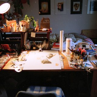 Creative workspace filled with art supplies and tools.