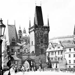 Historic Prague Charles Bridge with statues and towers.