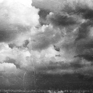 Stormy sky with dramatic clouds and rain.