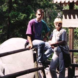 Two people posing near rock formations in Sächsische Schweiz.