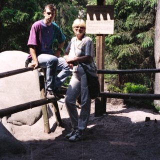 Two people posing near rock formations in Sächsische Schweiz.