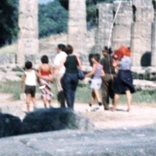Ancient Greek ruins with standing columns and ruins.