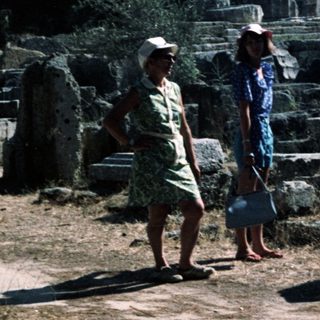 Ancient ruins with two people walking.