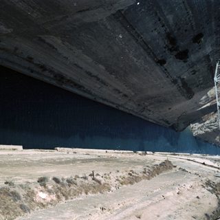 Dam spillway with water release.