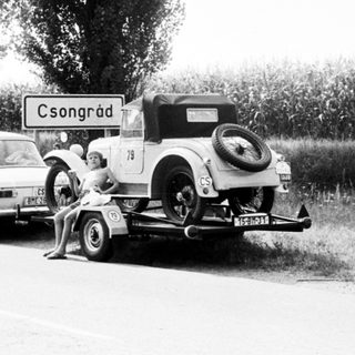 Classic cars towing on rural road near Csongrád.