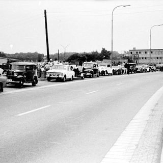 Vintage street scene with heavy traffic congestion.
