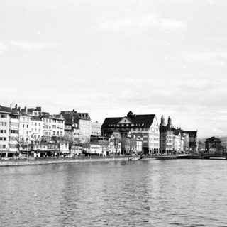 Historic waterfront cityscape with traditional European architecture.