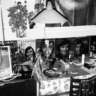 Vintage record store display with posters and albums.
