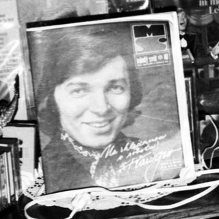 Vintage record store display with posters and albums.