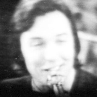 Blurred live musician performing on stage.